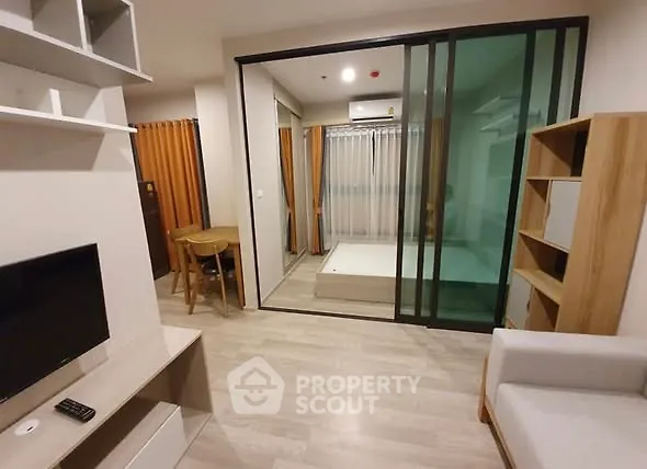 Modern living room with sliding glass doors and cozy furnishings