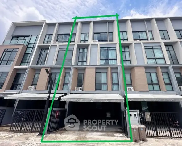 Modern multi-story townhouse with sleek design and spacious garage