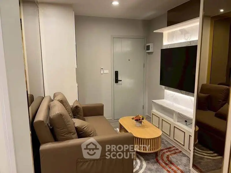 Cozy living room with modern decor and comfortable seating in a stylish apartment.