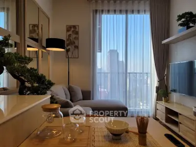 Modern living room with city view, cozy sofa, and stylish decor