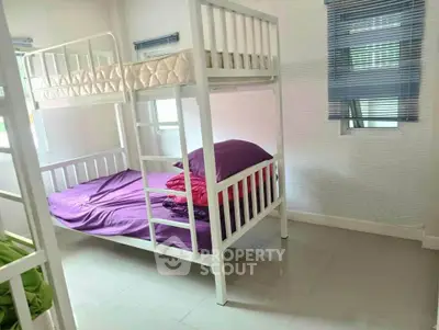 Cozy bedroom with bunk bed and bright natural light