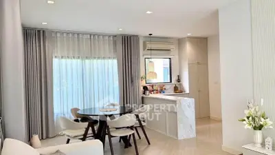 Modern open-plan living room with dining area and stylish kitchen