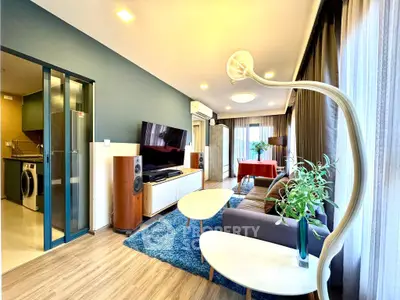 Modern living room with stylish decor and open kitchen layout