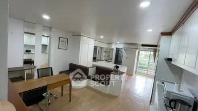 Spacious studio apartment with modern furnishings and balcony view