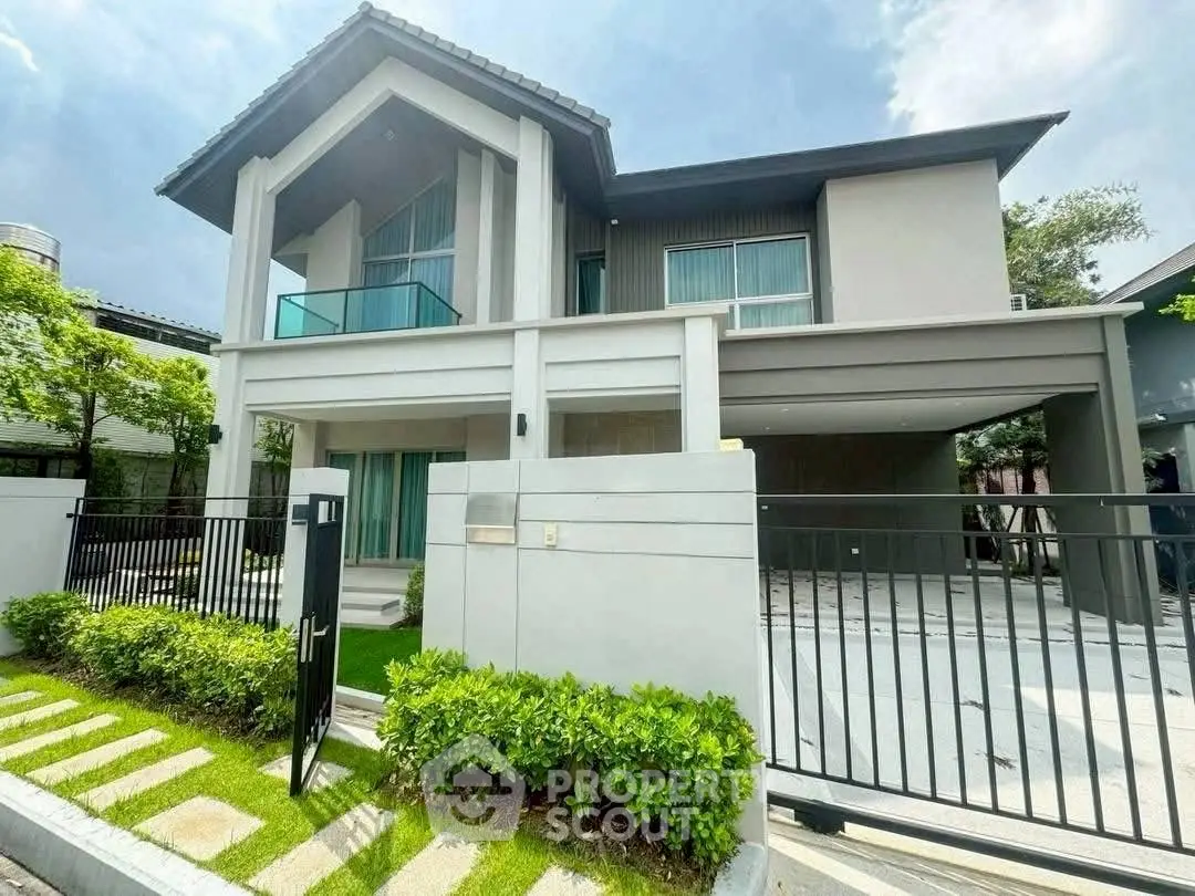 Modern two-story house with sleek design and spacious driveway