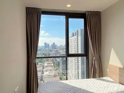 Modern bedroom with stunning city view from high-rise window