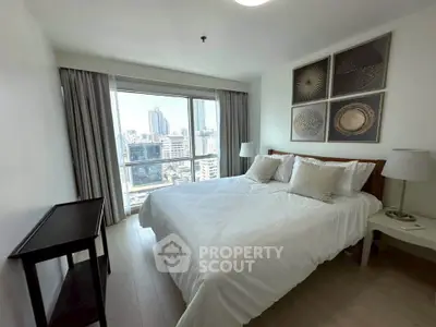 Spacious bedroom with city view in modern apartment
