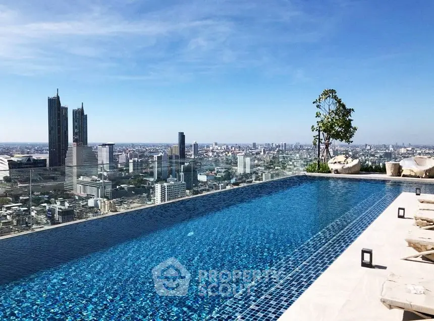 Stunning rooftop pool with panoramic city skyline views, perfect for luxury urban living.