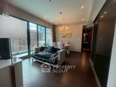 Modern living room with elegant decor and large windows offering city views