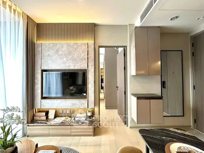 Modern living room with stylish decor and built-in TV unit