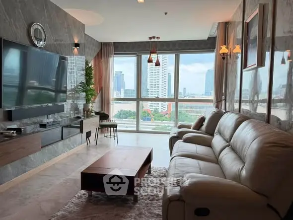 Luxurious living room with modern decor and stunning city view through large windows.