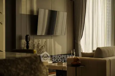 Luxurious modern living room with elegant decor and wall-mounted TV, bathed in warm natural light.