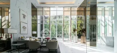 Luxurious living room with floor-to-ceiling windows and elegant decor