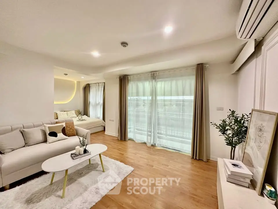 Spacious modern living room with cozy seating and natural light