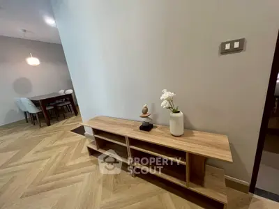 Modern dining area with stylish wooden flooring and elegant decor