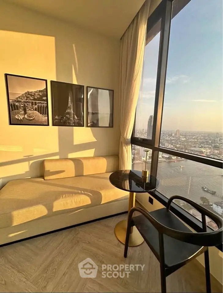 Stunning high-rise living room with panoramic city view and elegant decor.