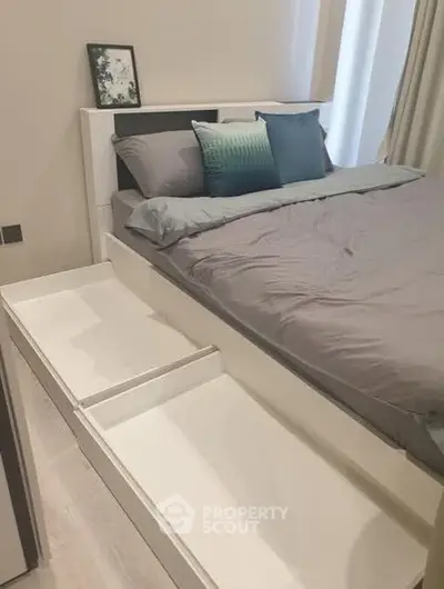 Modern bedroom with sleek storage bed and stylish decor