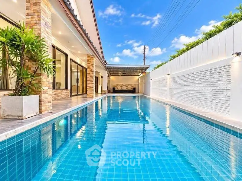 Luxurious modern home with stunning private pool and elegant exterior design.