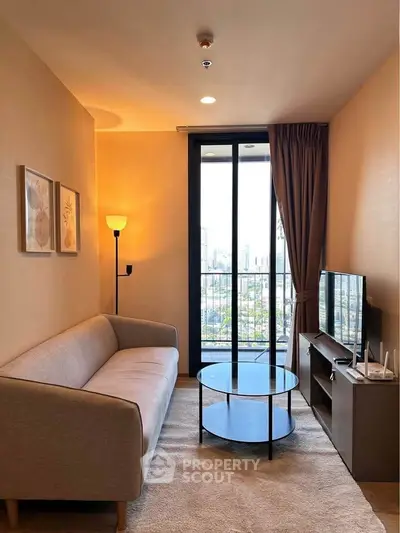 Cozy living room with modern decor and city view from large window.