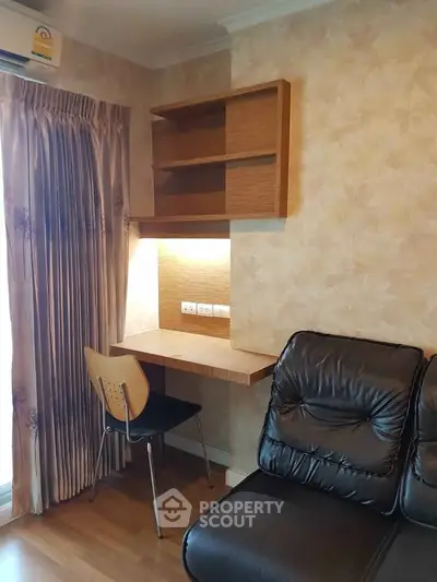 Cozy living room with built-in study nook and elegant curtains, perfect for modern living.