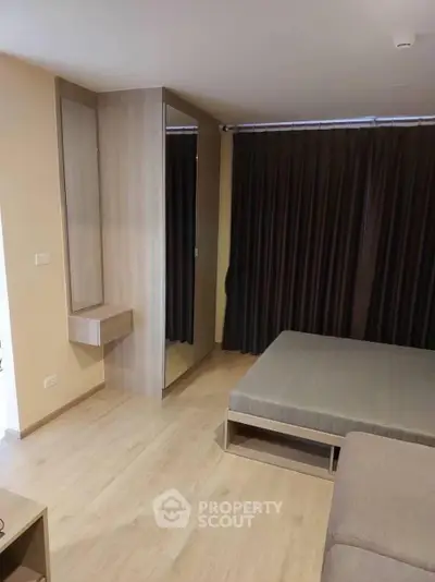 Modern bedroom with minimalist design and wooden flooring