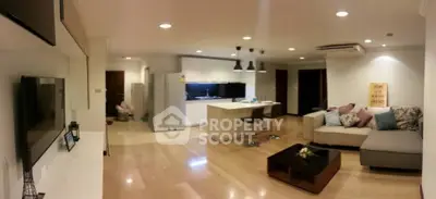Spacious modern living room with open kitchen and stylish decor