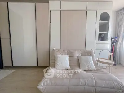 Modern bedroom with stylish furniture and ample storage space