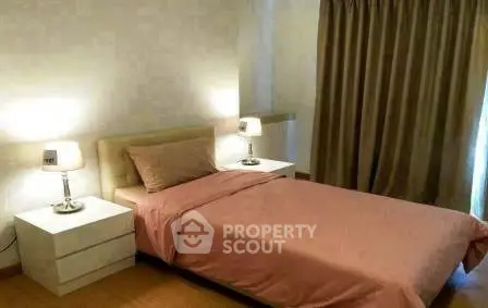 Cozy bedroom with elegant decor and soft lighting, perfect for relaxation.