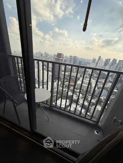 Stunning high-rise balcony with panoramic city skyline view, perfect for urban living.