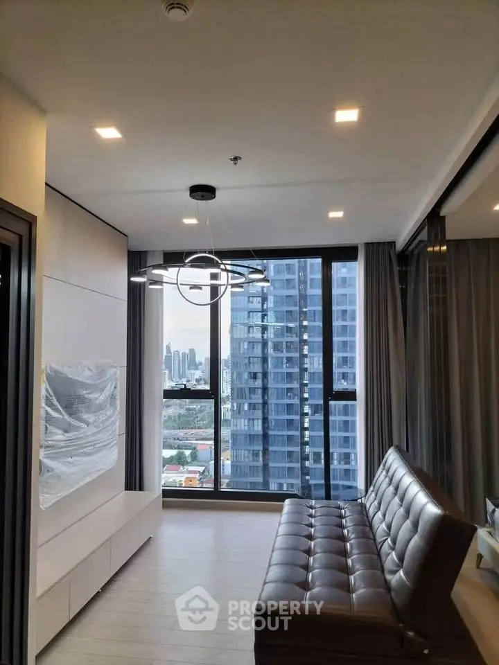 Modern living room with city view and stylish lighting