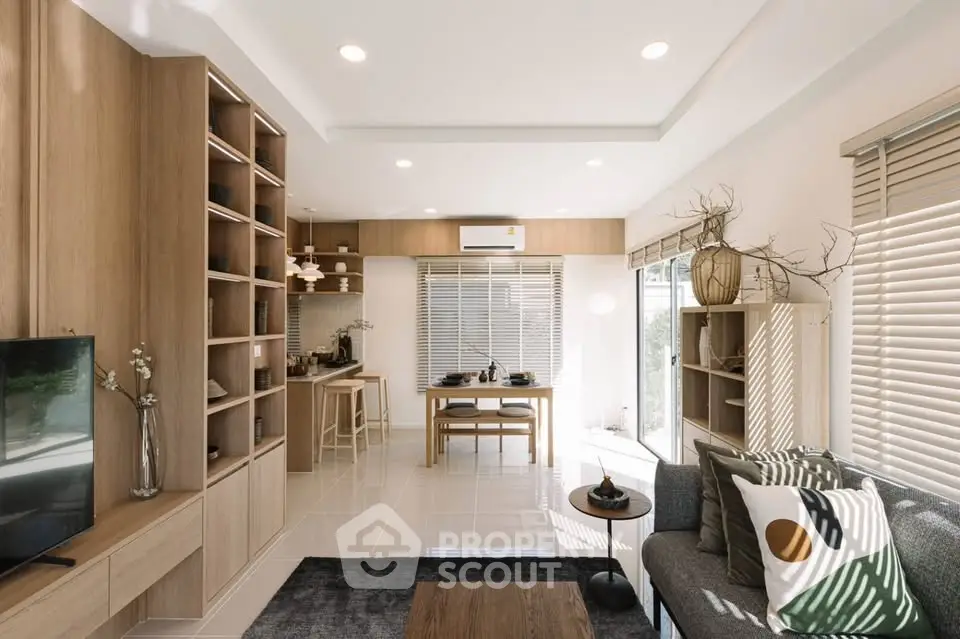 Modern open-plan living room with stylish decor and natural light