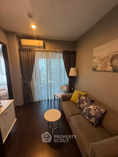 Cozy living room with modern decor and large window view