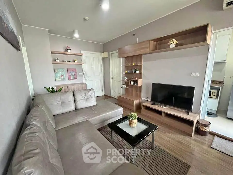 Modern living room with cozy sectional sofa and stylish wooden shelves
