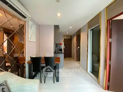 Modern apartment interior with dining area and open kitchen layout