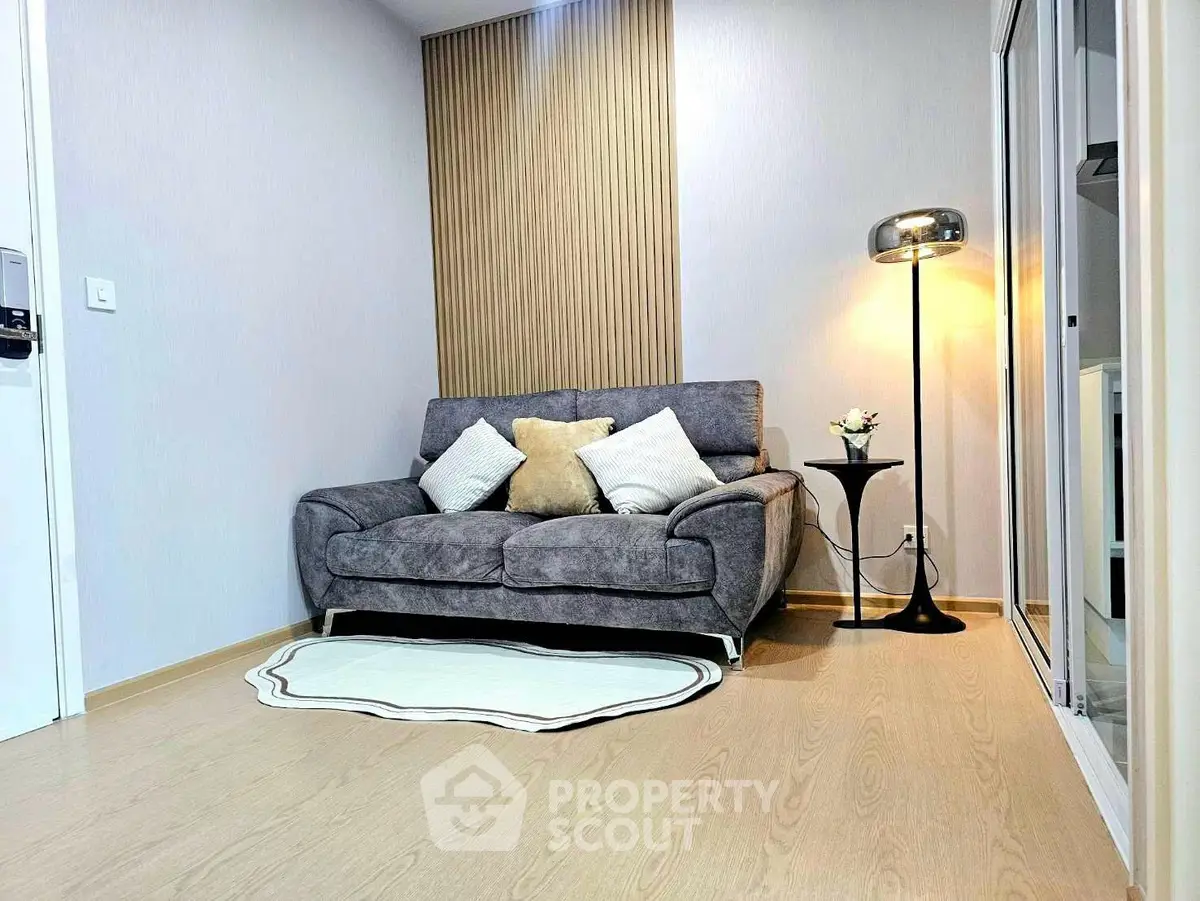 Cozy living room with modern sofa and stylish floor lamp