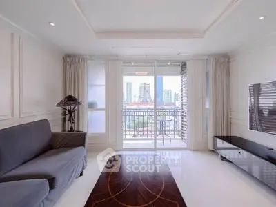 Spacious living room with modern decor and city view balcony