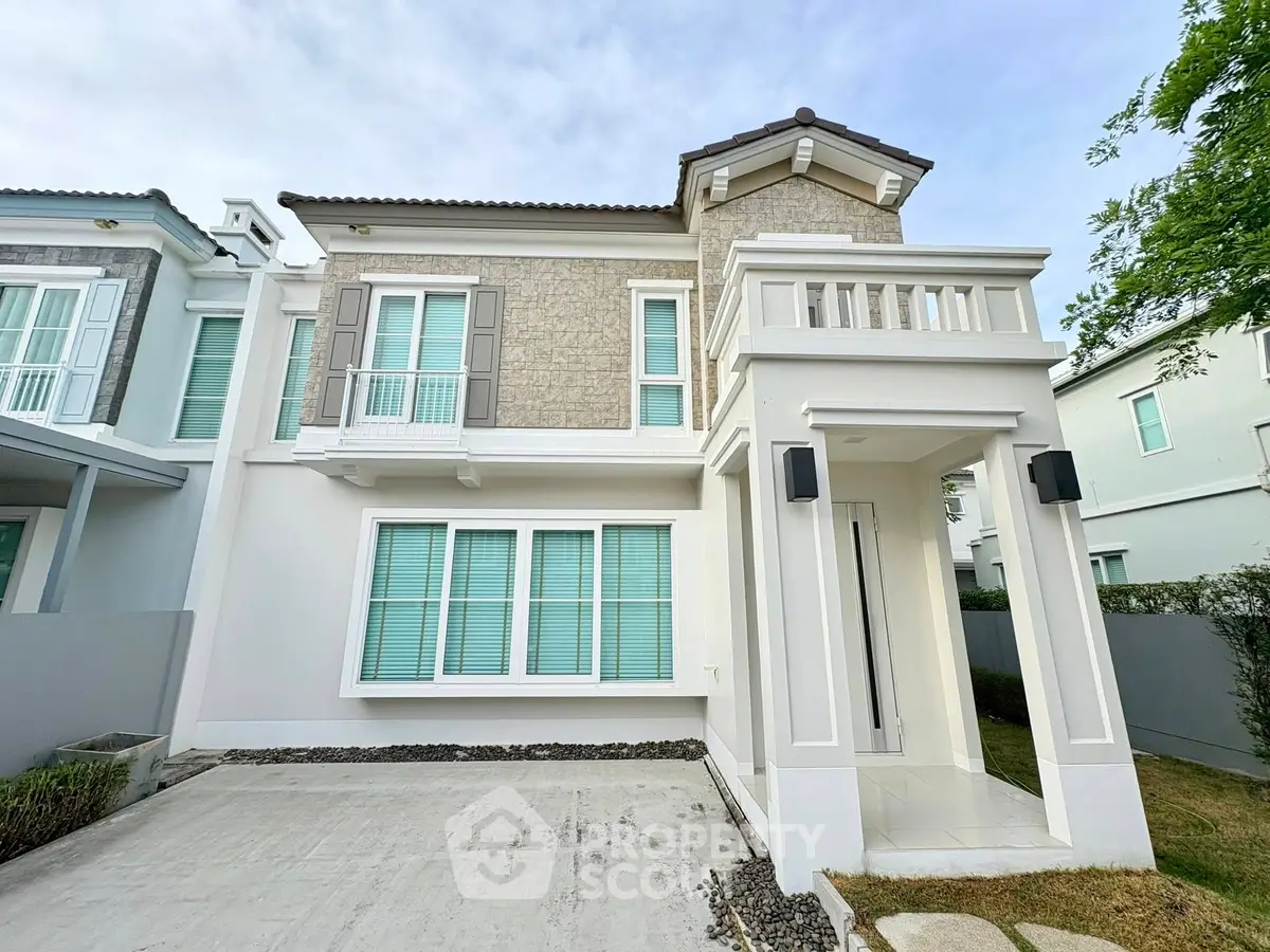 Stunning modern two-story house with elegant facade and spacious driveway in a serene neighborhood.