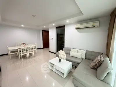 Spacious living room with modern furniture and dining area