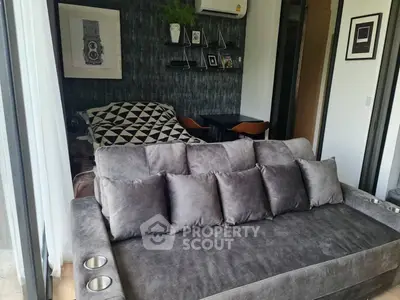 Modern living room with plush gray sofa and stylish decor