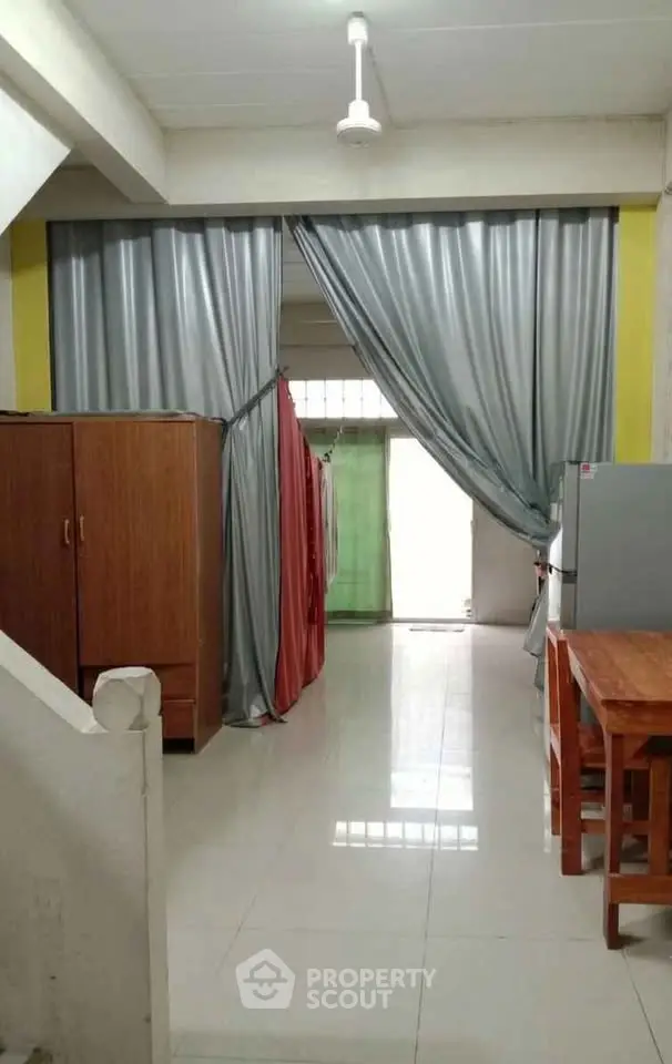Spacious interior with modern furnishings and natural light, ideal for comfortable living.