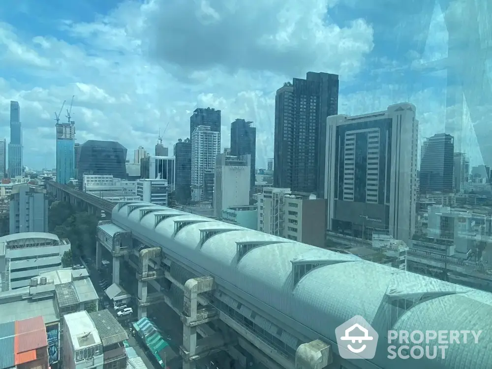 Stunning cityscape view from high-rise building showcasing urban skyline and architectural marvels.