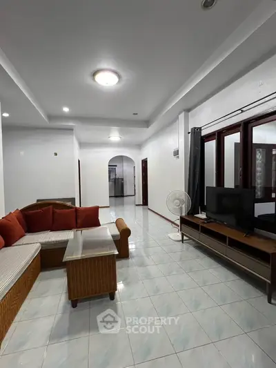 Spacious living room with modern furniture and natural light