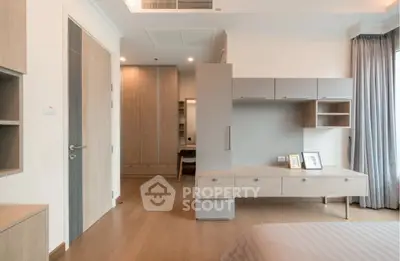 Spacious modern bedroom with elegant wooden furniture and natural light