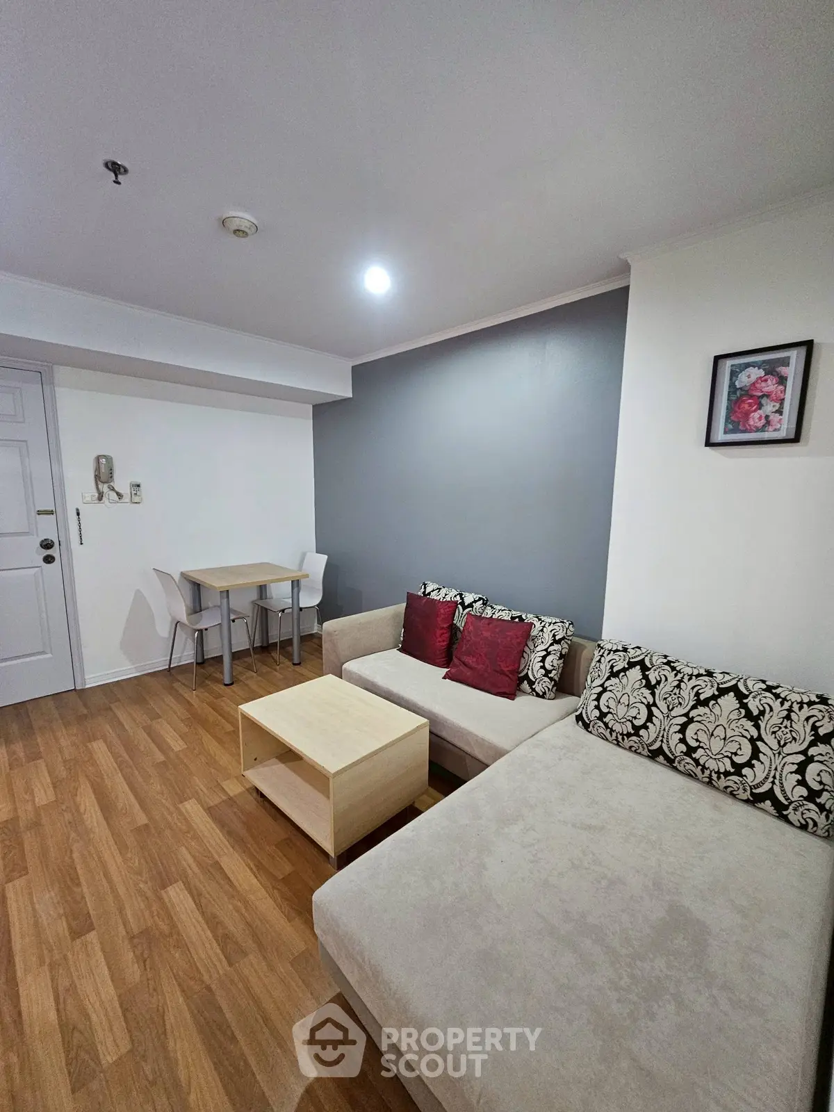 Modern living room with stylish decor and cozy seating area in a contemporary apartment.