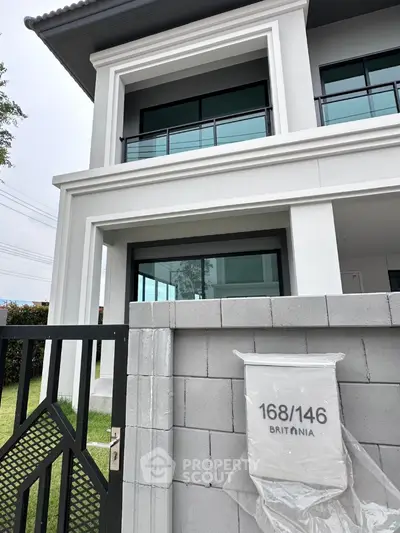 Modern two-story house with sleek design and spacious balcony
