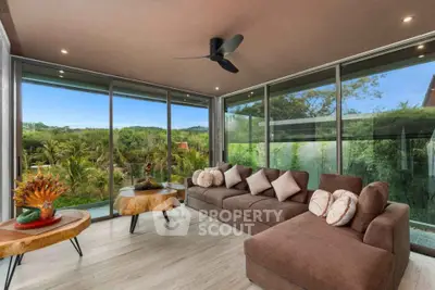 Luxurious living room with panoramic forest views and modern decor