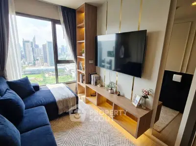 Modern living room with city view, stylish furniture, and large TV