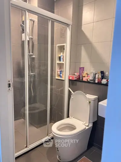 Modern bathroom with glass shower and sleek tile design