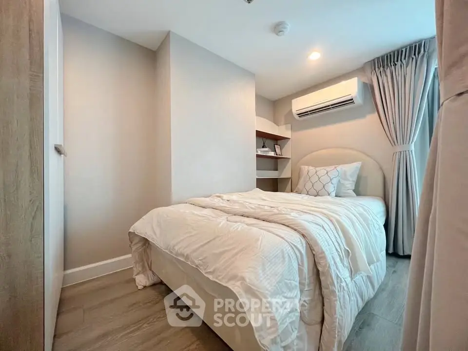Cozy bedroom with modern decor and natural light, featuring a comfortable bed and stylish curtains.
