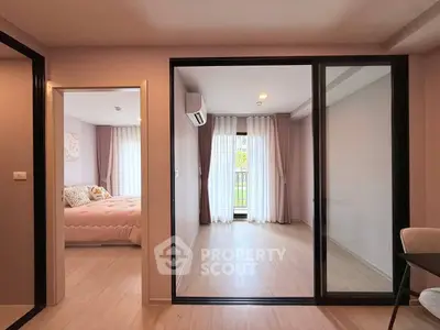 Modern apartment interior with bedroom and versatile space, featuring large windows and elegant decor.